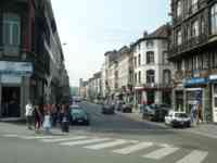 Street with shops and residential buildings