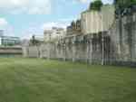 Grassy field outside castle wall