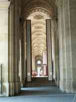 Café between columns, under high arched ceiling