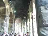 Between the two outer rings of arches in the Colosseum