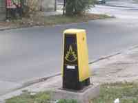 Yellow and black enclosure next to a street