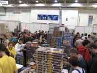 People shopping among stacks and stacks of games