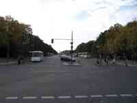 Large city street with monument visible in distance