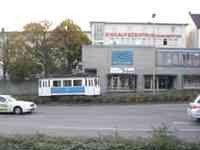 Small white and blue streetcar