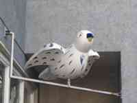 White sparrow sculpture with abstract shapes